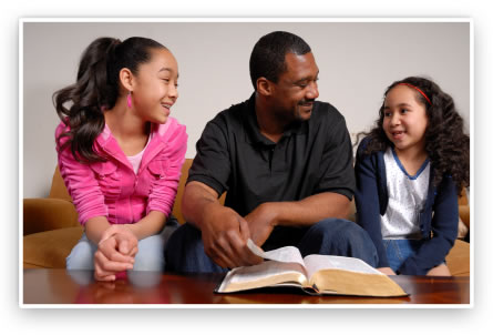 A father explains the Bible to his children.