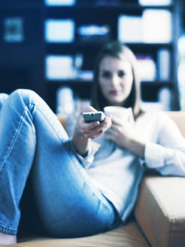 BUSY - a woman holding a TV remote