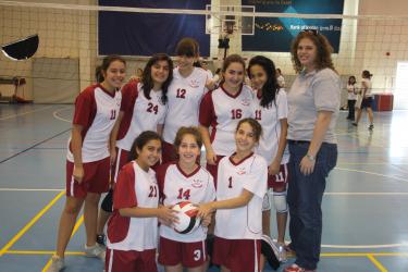 stella helterbrand with the volleyball team she coached in Jordan