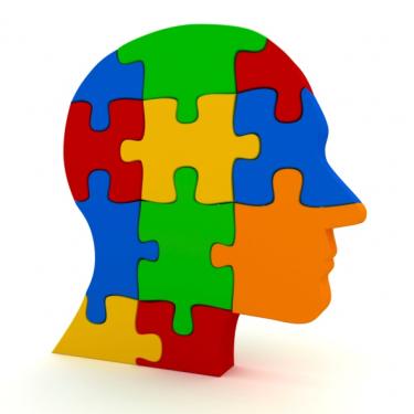 Multi-colored jigsaw puzzle pieces that make shape of human head - Just For Yout