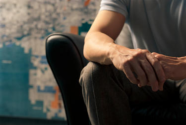Man sitting in leather chair.