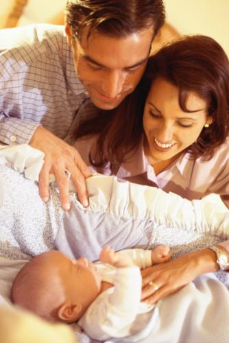 Parents and newborn baby - Parenting in the 90