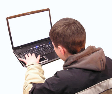 teenage boy using laptop computer