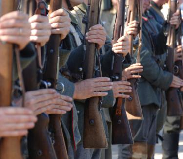 Men holding guns in a row - World News and Trends: New Three-Pronged Axis on the