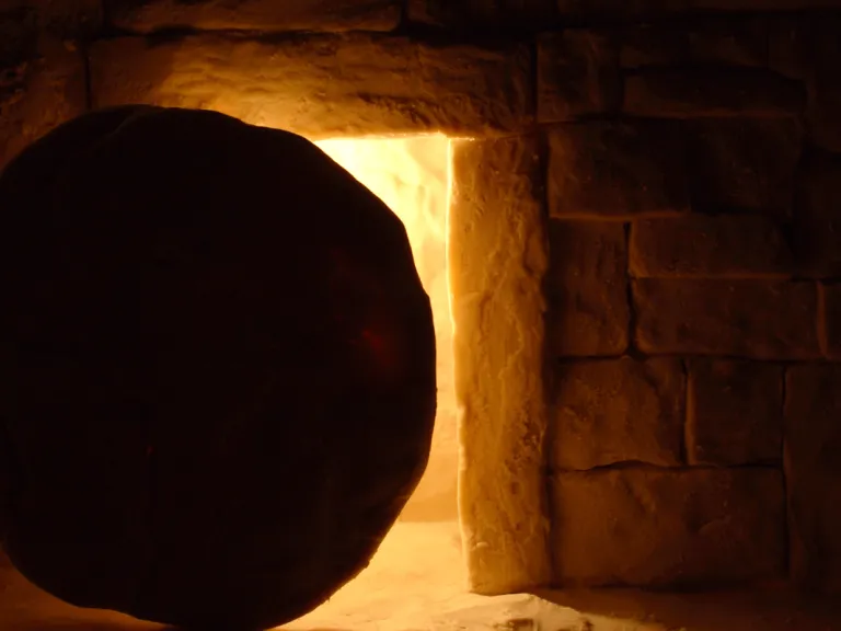 The heavy stone sealing the tomb in which Jesus was laid was rolled away not to let Him out, but to let His followers and others see that the tomb was empty and He was risen. A round stone in front of a tomb.