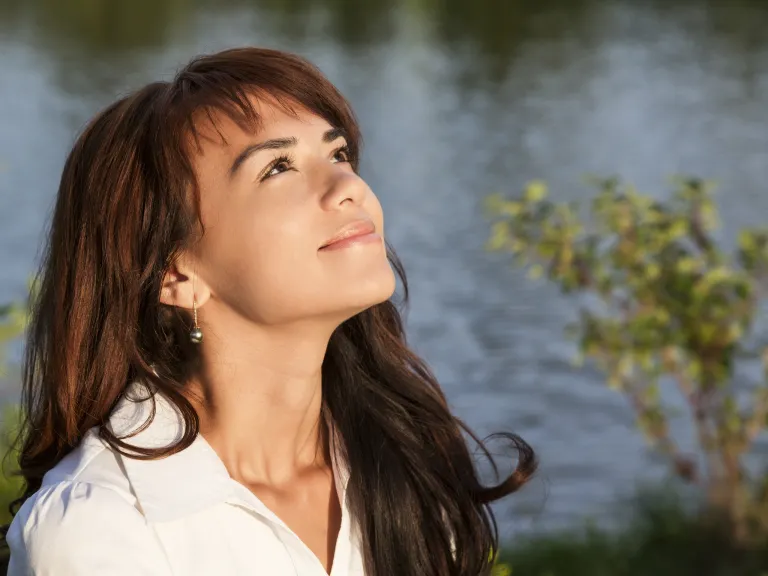 It's vital that we focus on the big picture—that God's intervention and coming Kingdom are just around the corner. A woman looking up at the sky.