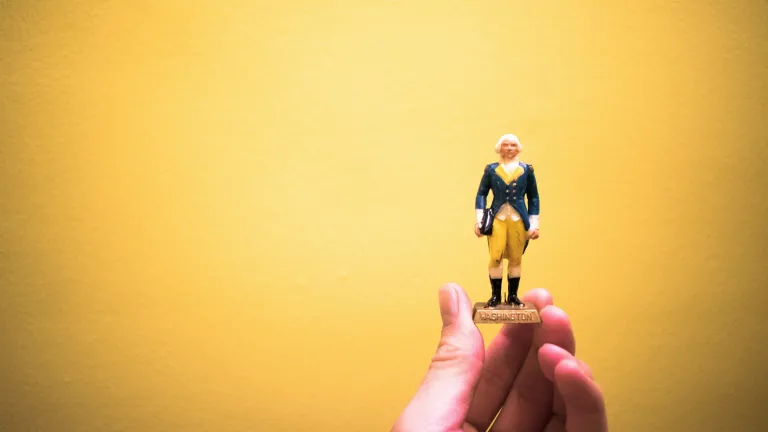 God at times has been directly involved in elevating individuals to very prominent positions. A person holding a small figurine in their hand.