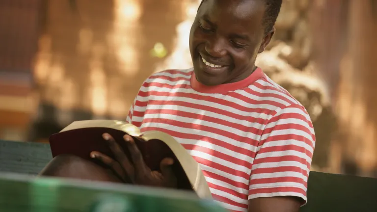 By refraining from our usual work and other activities on the Sabbath day, we have additional time to spend with God to build and strengthen our relationship with Him. A young man reading the Bible.