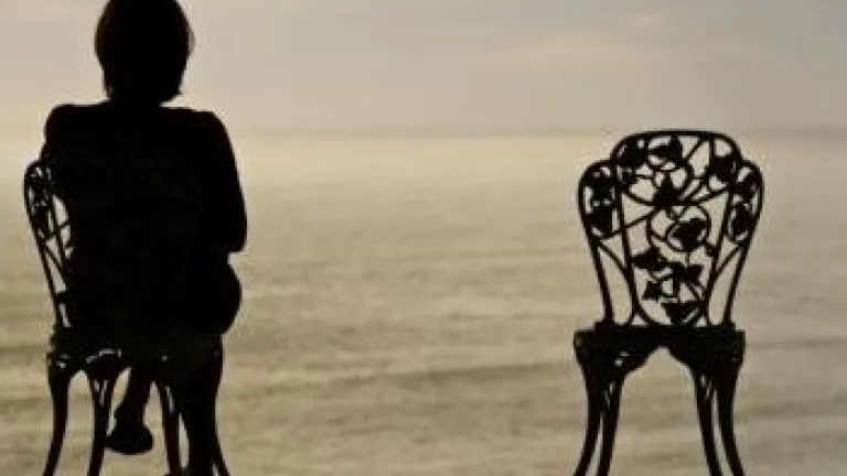 In the Shadow of Death Woman and empty chair - In the Shadow of Death