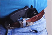 Man carrying a gun in his pants.