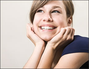 A teen age girl looking up.