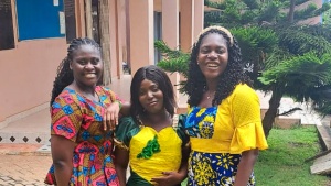 three women standing outdoors