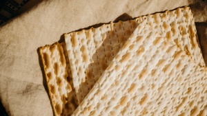 three matzos sitting atop a piece of cloth