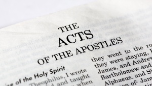Bible opened to the book of Acts.