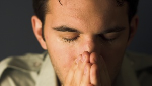 A man praying.