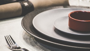 A table set with plates for a dinner.