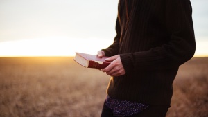 A man holding a Bible.