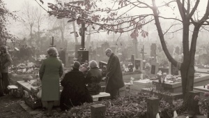 People at a grave site.