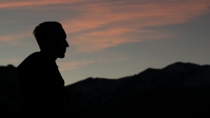 A silhouette of young man.