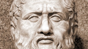 A bust of Plato's face in stone.