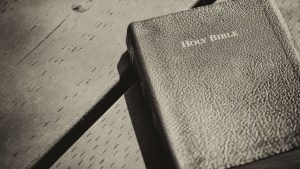 A Bible laying on a table.