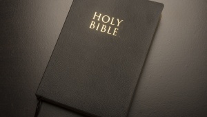 A Bible laying on a table.