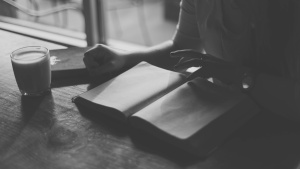 A woman reading a Bible.