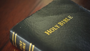 A Bible laying on a table.