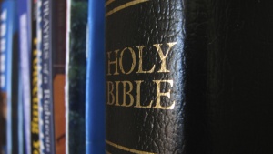 Bible on a book shelf.