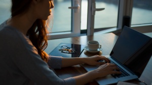 A woman using a laptop computer.