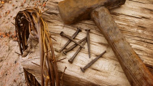 Crown of thorns, old nails and old hammer.