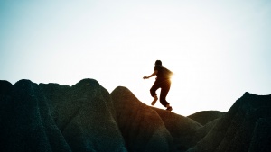 A person running up a mountain.