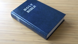 A Bible laying on a table.