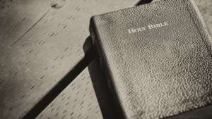 Bible laying on top of a table