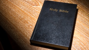 A Bible laying on a table.