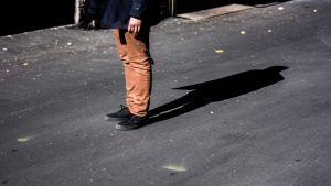 Shadow of a person's legs.