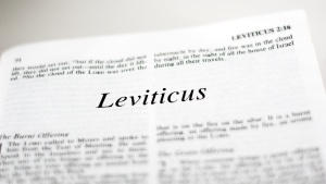 A Bible opened to the book of Leviticus.