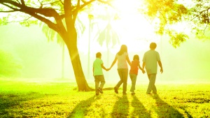 A family walking together outside.