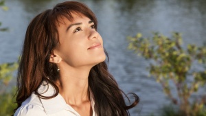 A woman looking up at the sky.