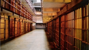 The hallway inside of a prison.