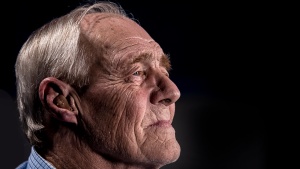 An older man looking away from the camera.