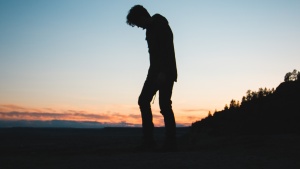 A silhouette of young man.