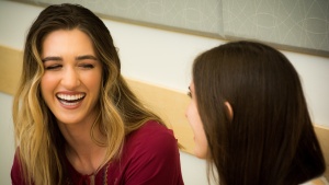 Two woman talking to each other.