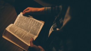 A man reading a Bible.