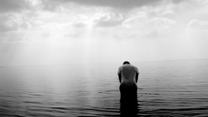 A man standing in water.