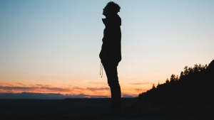 A silhouette of young man.