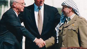 Israeli Prime Minister Yitzhak Rabin, U.S. President Bill Clinton and Yasser Arafat at the Oslo I Accord signing in 1993.