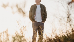 A man walking in a field.