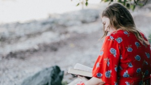 A woman reading a Bible.