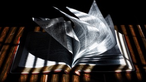 A Bible laying on a table.